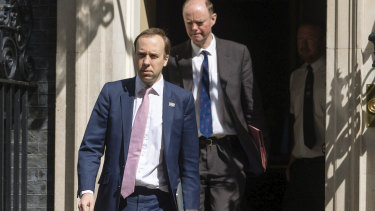 Britain's Health Secretary Matt Hancock (left) and Chief Medical Officer Chris Whitty outside 10 Downing Street on May 4.