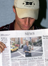 Back in Adelaide, Lleyton Hewitt holds a picture of himself holding his US Open Tennis Trophy taken in New York the previous day.
