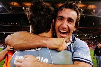 Rescue act: Johns, pictured with Anthony Minichiello, returned from injury to inspire the Blues to a series win in 2005.