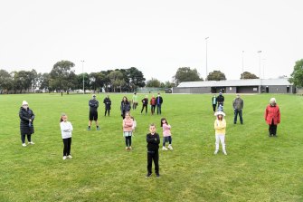 Coburg North residents at the Hosken Reserve football oval in 2020 when there were plans to replace the grass oval with synthetic soccer pitch. 