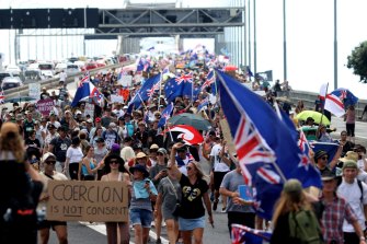 Anti-Covid vaccine mandate protesters march over the Auckland Harbour Bridge on February 26.