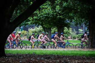 Participants in the the World Naked Bike Ride in Melbourne enjoy lovely parkland and a refreshing spring breeze.
