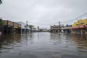 Byron Bay’s main street should be filled with tourists, but instead it is deserted as floodwaters hit the area.