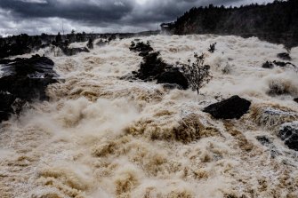 Water from Wyangala Dam explodes in the valley on the Lachlan River. 
