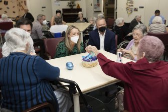 Prime Minister Anthony Albanese meets residents at an aged care facility during the election campaign. His government has now backed a “significant” pay rise for aged care workers.