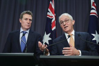 Former prime minister Malcolm Turnbull (right) says his former attorney-general, Christian Porter, (left) seen in a 2018 file picture when both were still in those positions, should disclose who paid his legal fees for a defamation case against the ABC 
