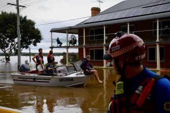 Locals navigate flooding on the Hawkesbury River in March 2022. The electorate of Macquarie has been hit by multiple natural disasters since the last election