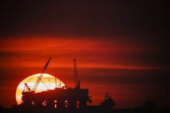 BHP, the countryâ€™s biggest miner, is in talks to sell its oil and gas division to Woodside Petroleum.