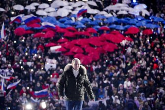 Russian President Vladimir Putin  attends a concert in 2021 marking the seventh anniversary of the annexation of Crimea. 