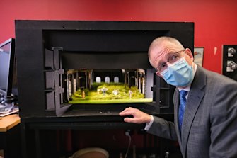 Federal Arts Minister Paul Fletcher looks over a model set at MTC.