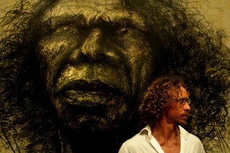 Craig Ruddy with his popular but controverial Archibald Prize-winning portrait of David Gulpilil in 2004.