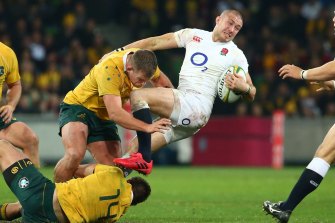 Wrapped up: England’s Mike Brown is tackled at AAMI Park in 2016.