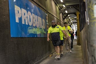 Workers leave the UNO Melbourne worksite after the project builder Probuild have gone into administration, with $5bn worth of unfinished projects around Australia. 