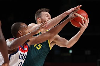 Nic Kay rebounds ahead of Khris Middleton.