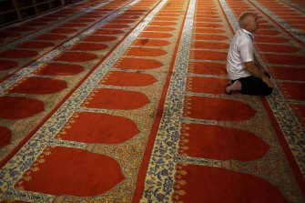 A man prays at the Sultan Suleyman Mosque in Istanbul. 