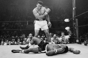 Heavyweight champion Muhammad Ali stands over challenger Sonny Liston after the pair fought for a second time in 1965.