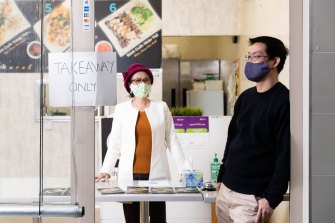 Anthony Dinh with his mother, Kim Thanh, in their restaurant, Banh Cuon in Bankstown during lockdown.