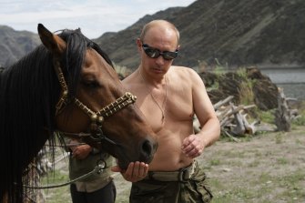 Vladimir Putin, pictured in 2009, has crafted an image of he-man masculinity.