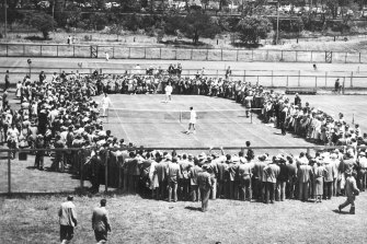 Lew Hoad and Ken Rosewall practise at Kooyong before their Davis Cup final in 1953. Coach Harry Hopman watches from the sidelines. 