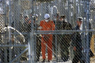 New detainees escorted through Guantanamo in 2002, when it held hundreds of prisoners. There are only 40 held there now. 