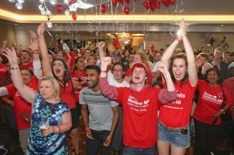 Labor Party supporters celebrate as they watch the results come in for the 2014 Victorian state election. 
