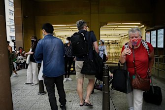 Commuters at one of the closed entrances at Central Station.