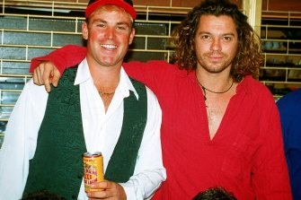 Shane Warne with Michael Hutchence, lead singer of INXS in England in 1993.