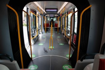 A pigeon is the only passenger on a deserted tram in Sydney’s locked-down CBD.