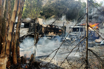 Smokes and flames billow from vehicles in Hpruso township, Kayah state, in Myanmar.