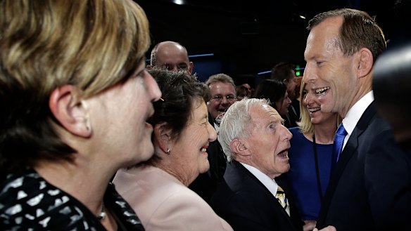 Tony Abbott greets his father Richard Abbott during the Federal Coalition campaign launch in August 2013.
