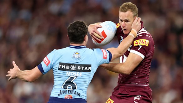 Mitchell Moses of the Blues tackles Daly Cherry-Evans in game one of the 2025 State of Origin series.