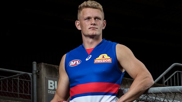 Adam Treloar tries out his new jersey. 
