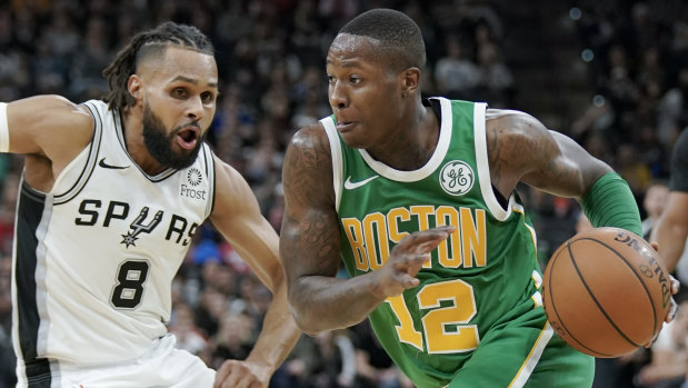 Turnaround: two three-pointers to Patty Mills (left) sparked a remarkable NBA comeback for San Antonio.