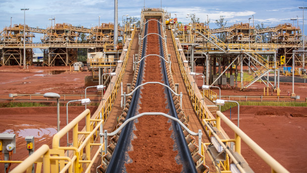 Tonnes of bauxite moves along a huge conveyor belt at Rio Tinto's new Amrun bauxite mine on Cape York, Queensland.