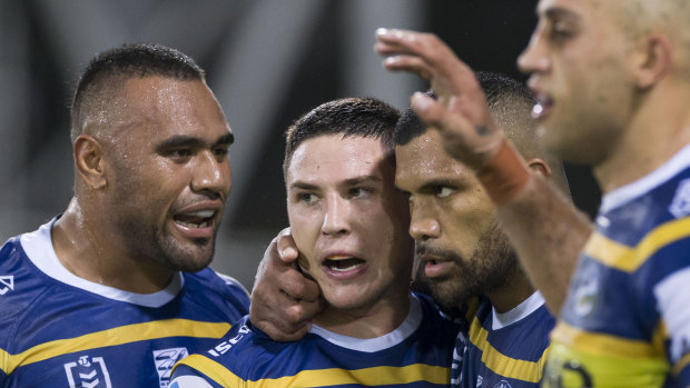 Team first: Moses celebrates with his fellow Eels.