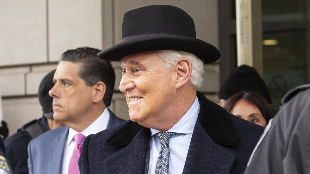 Roger Stone, former adviser to Donald Trump's presidential campaign, centre, exits federal court in Washington after being sentences to 3 years and 4 months in prison.