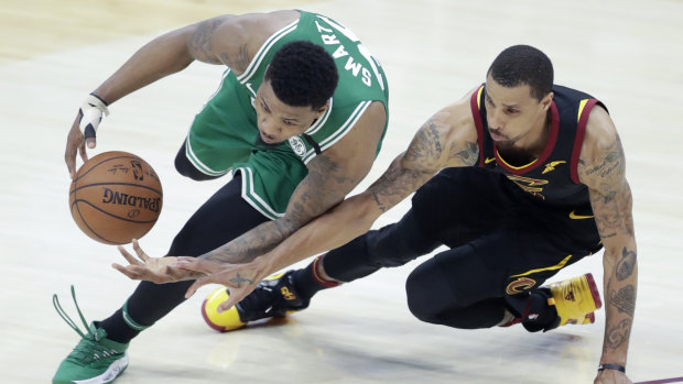 Boston's Marcus Smart under pressure from Cleveland's George Hill.