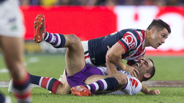 Cooper Cronk and Cameron Smith collide in the 2018 grand final.