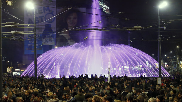 People march during a protest against populist President Aleksandar Vucic in Belgrade.