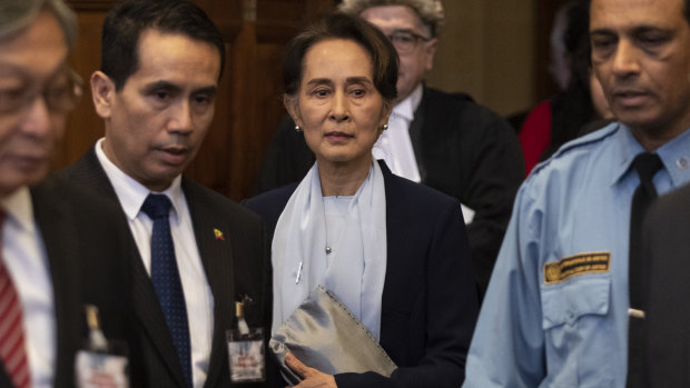 Myanmar's leader Aung San Suu Kyi enters the court room prior to addressing judges of the International Court of Justice.