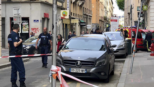 Police at the scene of a suspected bomb attack in central Lyon.