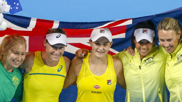 Daria Gavrilova, Stosur, Barty, Priscilla Hon and coach Alicia Molik celebrate Australia's win.