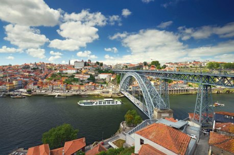 Scenic Azure sails into Porto on the Douro River in Portugal. River cruise ships can take you places ocean ships can’t go.
