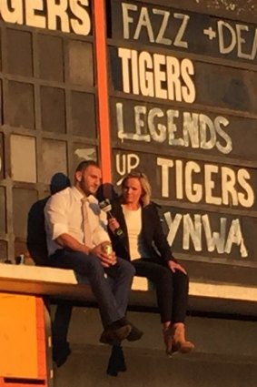 Farah took a moment to himself with a beer up on the Leichardt Oval scoreboard to mark his Tigers exit two years ago.