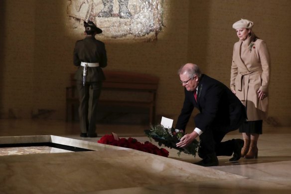 Prime Minister Scott Morrison and Jenny Morrison lay a wreath at the Tomb of the Unknown Australian Soldier during the Anzac Day commemorative service in 2020. 