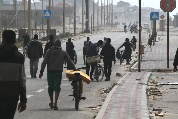Displaced Palestinians on the coastal road after fleeing the Al Shifa hospital area in north Gaza.