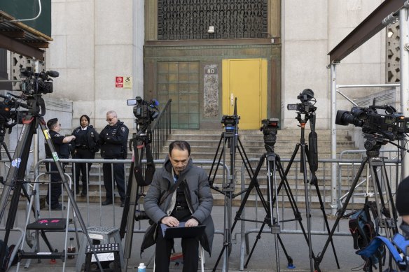 Television news cameras outside the district attorney’s office.