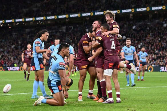 Kurt Capewell celebrates scoring a try with teammates during Origin game three in 2022.