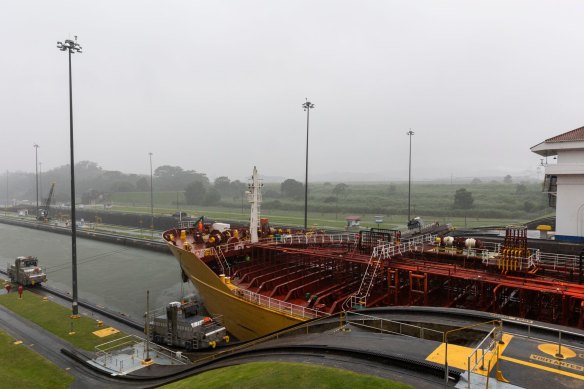 The Stolt Lotus tanker ship navigates through the Miraflores locks of the Panama Canal near Panama City, on Sunday.