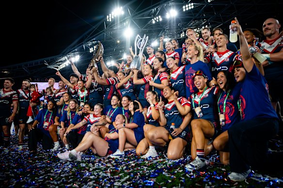 The Roosters’ NRL and NRLW teams celebrate their premierships together.